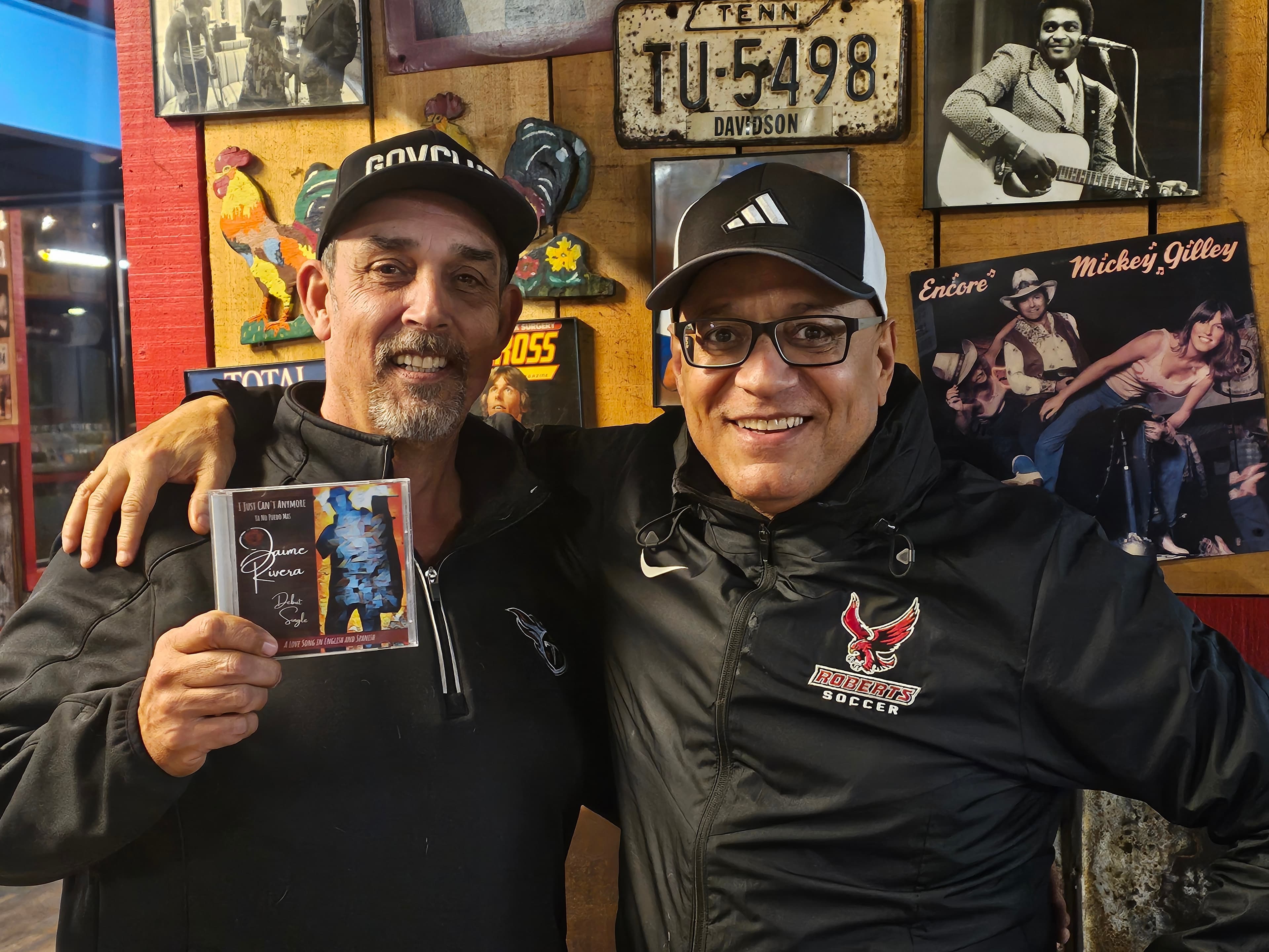 Picture of Rick Barker with Taylor Swift's golden vinyl